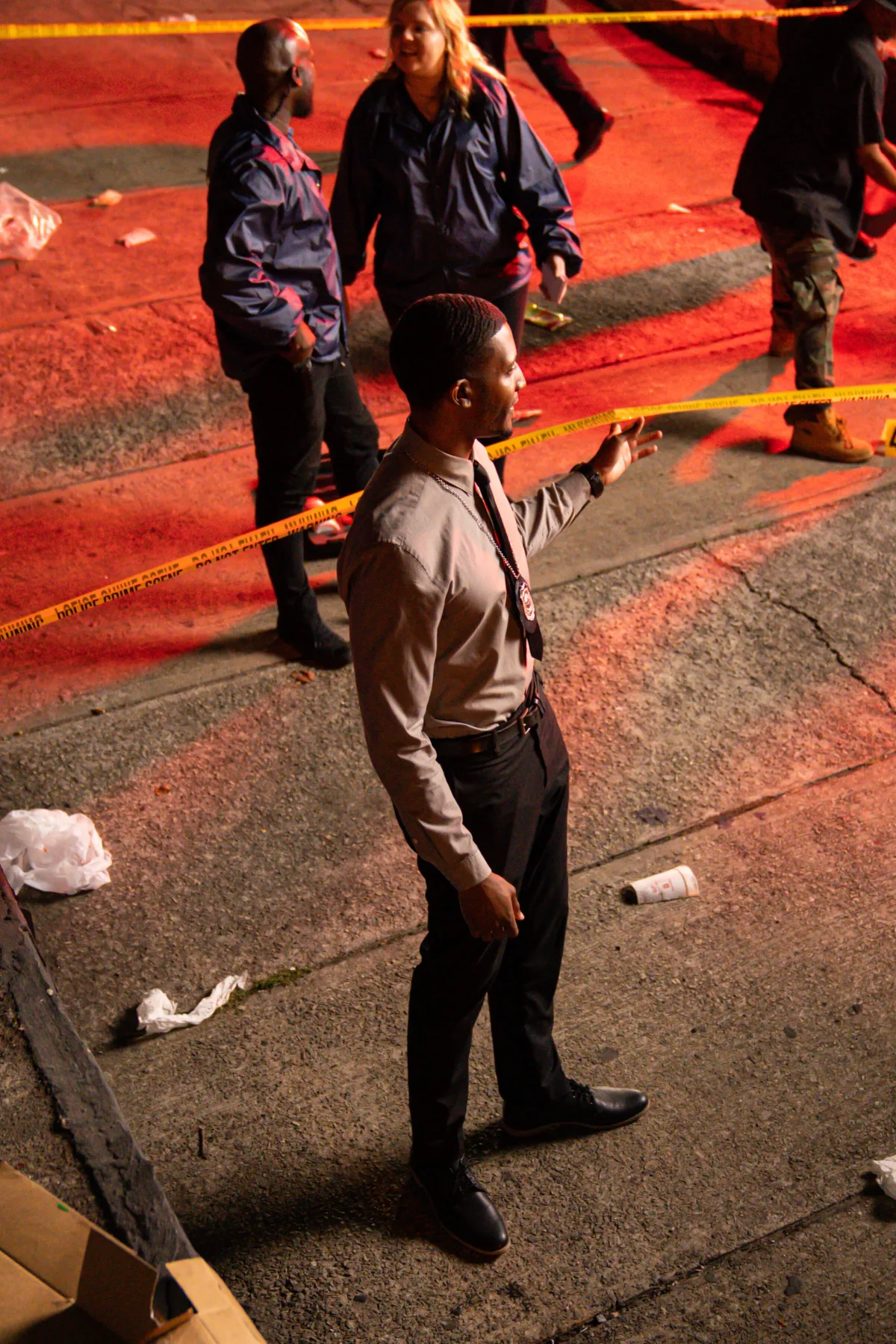 A night crime-scene set, Jae at the tape